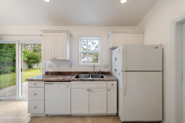 32 S Shelby Rd, Southport, NC 28461 - kitchen featuring white appliances, white cabinetry, and plenty of natural light