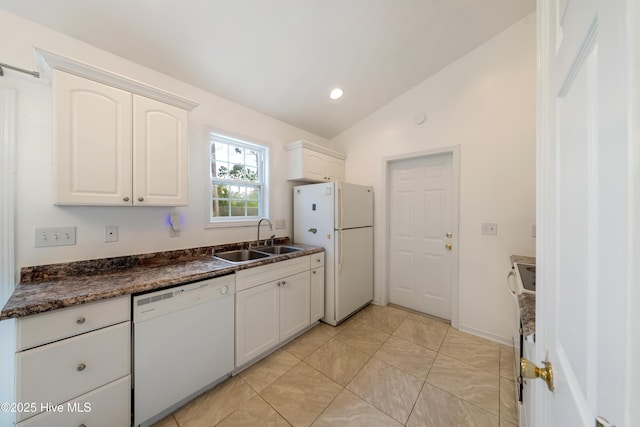 32 S Shelby Rd, Southport, NC 28461 - kitchen featuring white appliances, lofted ceiling, white cabinetry, and recessed lighting