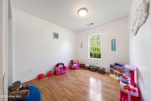 32 S Shelby Rd, Southport, NC 28461 - playroom with wood finished floors and baseboards