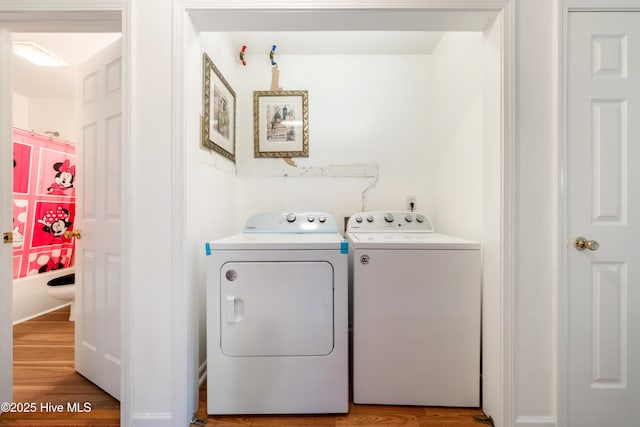 32 S Shelby Rd, Southport, NC 28461 - laundry area featuring washing machine and clothes dryer and light wood-style flooring
