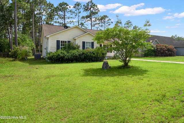 32 S Shelby Rd, Southport, NC 28461 - view of front of home featuring a front lawn and a shingled roof