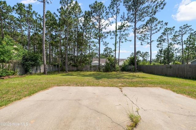 32 S Shelby Rd, Southport, NC 28461 - fenced backyard with a patio area