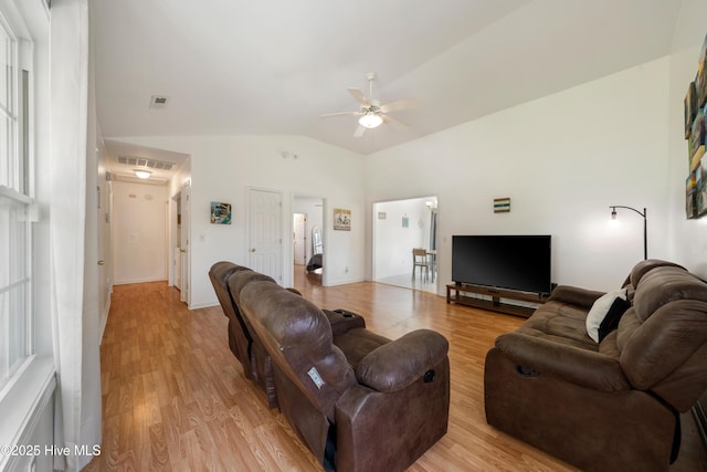 32 S Shelby Rd, Southport, NC 28461 - living room with a ceiling fan, light wood-type flooring, and vaulted ceiling