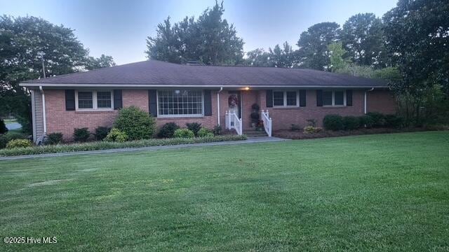 2262 Old Oak Rd, Kinston, NC 28504 - ranch-style home featuring a front lawn and brick siding