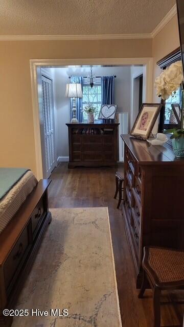 2262 Old Oak Rd, Kinston, NC 28504 - bedroom featuring wood finished floors, a textured ceiling, and crown molding