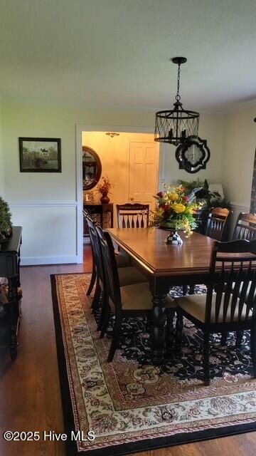 2262 Old Oak Rd, Kinston, NC 28504 - dining space with dark wood-style floors and a chandelier