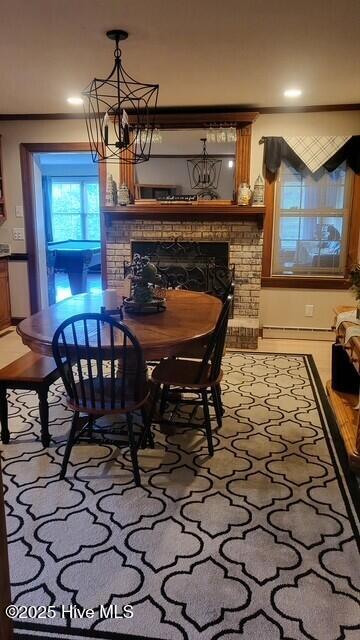 2262 Old Oak Rd, Kinston, NC 28504 - dining area featuring a fireplace, a chandelier, and recessed lighting