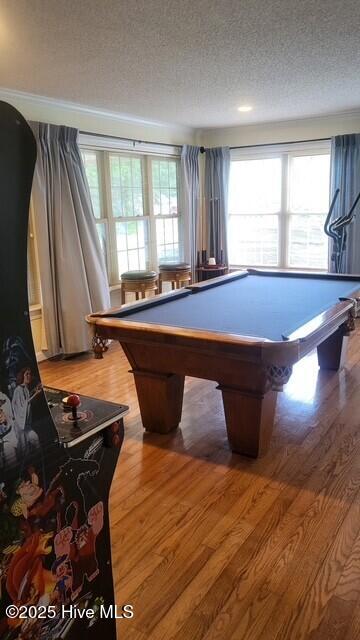 2262 Old Oak Rd, Kinston, NC 28504 - recreation room featuring a textured ceiling, wood finished floors, plenty of natural light, and billiards