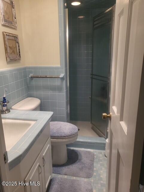 2262 Old Oak Rd, Kinston, NC 28504 - full bath with vanity, a shower stall, wainscoting, and tile patterned floors