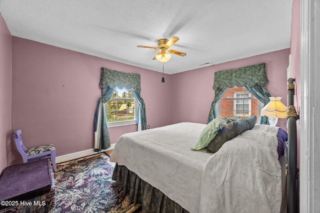 1710 National Ave, New Bern, NC 28560 - bedroom with multiple windows, a textured ceiling, carpet, and ceiling fan
