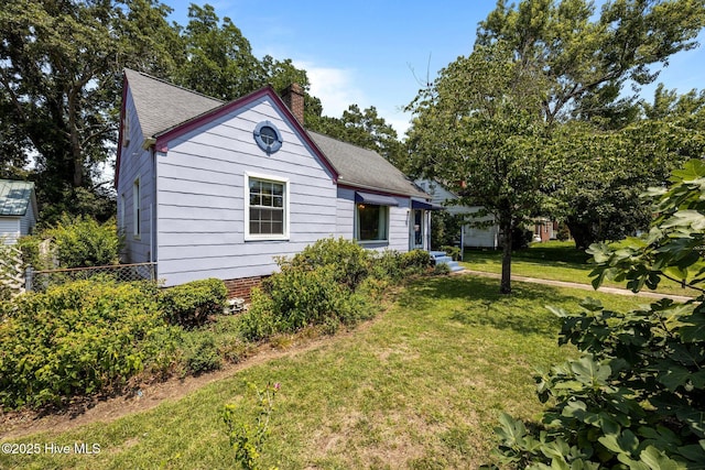 1710 National Ave, New Bern, NC 28560 - view of front of home with a chimney and a shingled roof