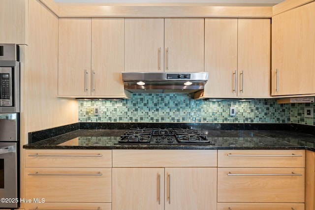 2945 Moorings Way SE, Southport, NC 28461 - kitchen with appliances with stainless steel finishes, under cabinet range hood, and light brown cabinets