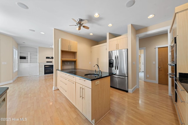 2945 Moorings Way SE, Southport, NC 28461 - kitchen with stainless steel appliances, light brown cabinets, light wood finished floors, ceiling fan, and recessed lighting
