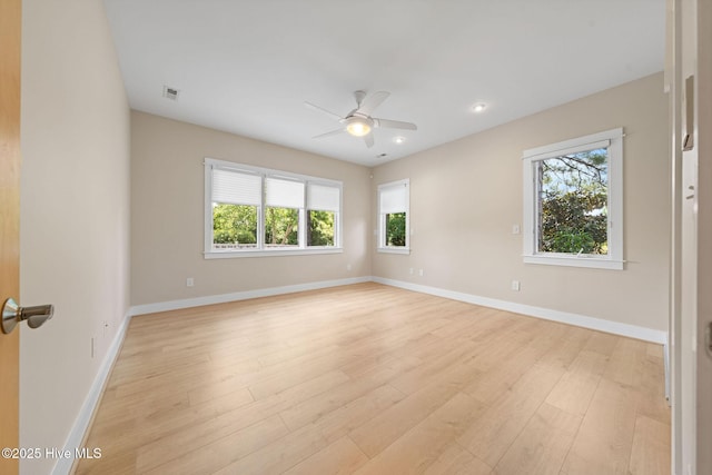 2945 Moorings Way SE, Southport, NC 28461 - empty room featuring healthy amount of natural light, light wood-type flooring, ceiling fan, and recessed lighting