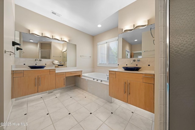 2945 Moorings Way SE, Southport, NC 28461 - bathroom featuring a garden tub and two vanities