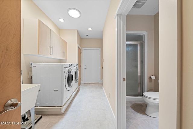 2945 Moorings Way SE, Southport, NC 28461 - washroom featuring light tile patterned flooring, washing machine and dryer, and recessed lighting