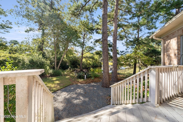 2945 Moorings Way SE, Southport, NC 28461 - wooden terrace with view of wooded area