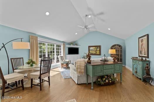 124 Juniper Creek Blvd Unit 16, Pinehurst, NC 28374 - living room with lofted ceiling, wood finished floors, ceiling fan, and recessed lighting