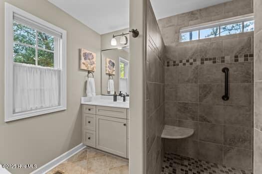124 Juniper Creek Blvd Unit 16, Pinehurst, NC 28374 - full bathroom with vanity, a tile shower, and tile patterned floors