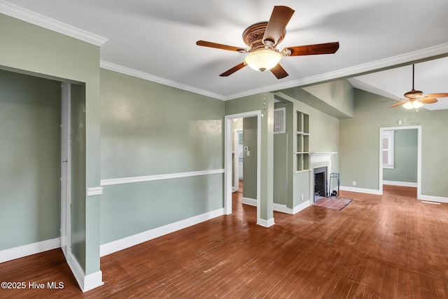 104 W Bayshore Blvd, Jacksonville, NC 28540 - unfurnished living room featuring ceiling fan, wood finished floors, ornamental molding, and a fireplace
