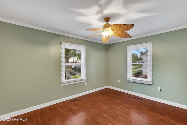 104 W Bayshore Blvd, Jacksonville, NC 28540 - unfurnished room with plenty of natural light, ornamental molding, wood finished floors, and ceiling fan