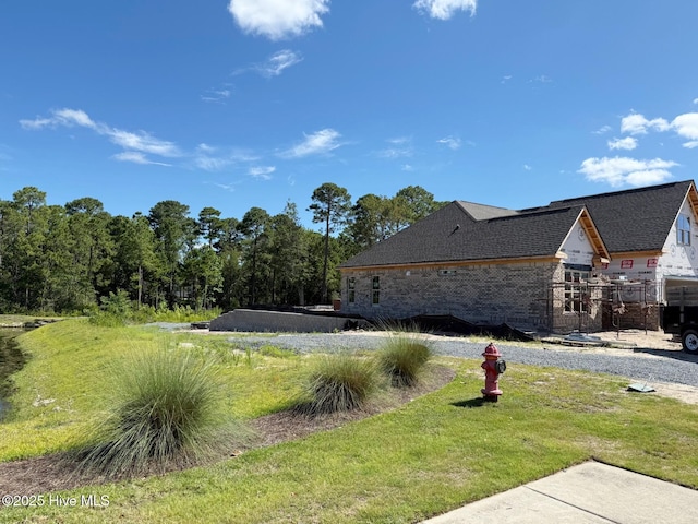 449 Motts Forest Rd Unit 64R, Wilmington, NC 28412 - view of home's exterior featuring a lawn