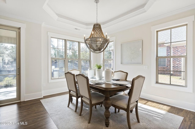 449 Motts Forest Rd Unit 64R, Wilmington, NC 28412 - dining room featuring a chandelier, a raised ceiling, ornamental molding, and dark wood-style floors