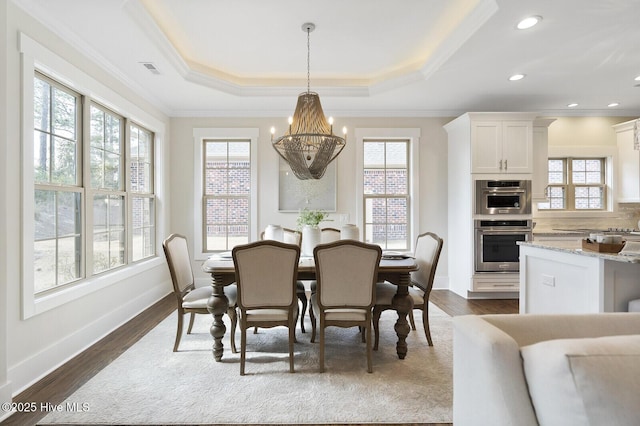 449 Motts Forest Rd Unit 64R, Wilmington, NC 28412 - dining space featuring a chandelier, plenty of natural light, crown molding, and dark wood-style floors