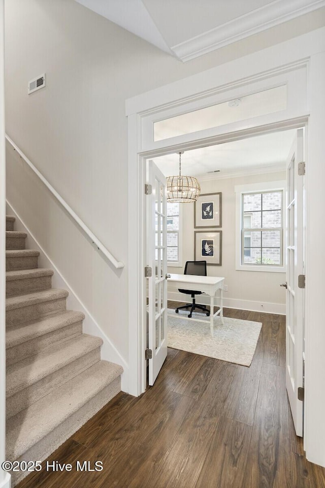 449 Motts Forest Rd Unit 64R, Wilmington, NC 28412 - foyer entrance featuring crown molding, dark wood-style floors, plenty of natural light, stairs, and french doors