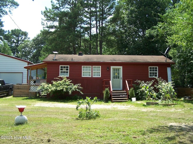 206 Community Rd, Eagle Springs, NC 27242 - view of front of property with entry steps and a front lawn