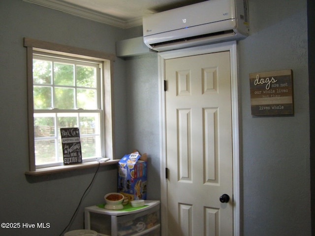 206 Community Rd, Eagle Springs, NC 27242 - interior space featuring an AC wall unit, healthy amount of natural light, and ornamental molding