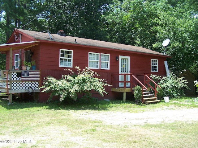206 Community Rd, Eagle Springs, NC 27242 - back of house featuring a yard