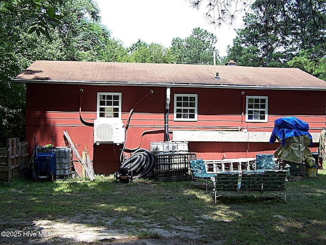 206 Community Rd, Eagle Springs, NC 27242 - back of property with roof with shingles and a lawn