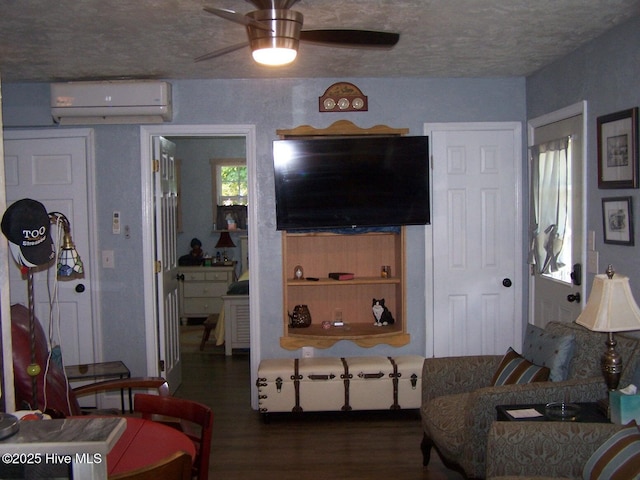 206 Community Rd, Eagle Springs, NC 27242 - living area featuring an AC wall unit, wood finished floors, and a ceiling fan