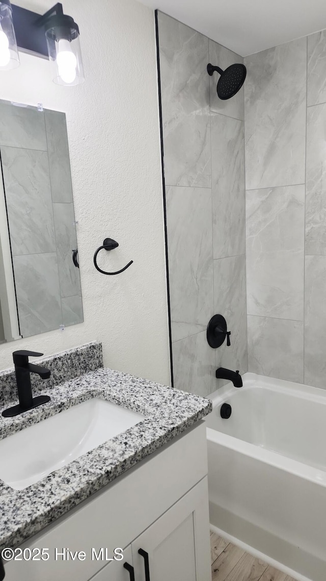 702A Richardson St # A, Elizabeth City, NC 27909 - full bathroom with vanity, bathtub / shower combination, and wood finished floors