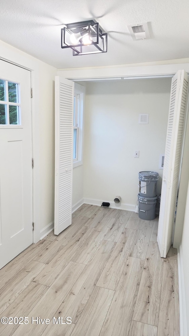 702A Richardson St # A, Elizabeth City, NC 27909 - laundry area featuring washer hookup and light wood-style flooring