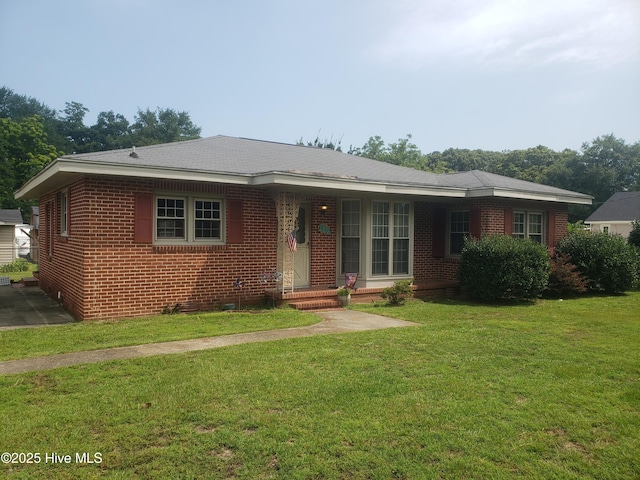 102 Bruce St, Snow Hill, NC 28580 - view of front facade with brick siding and a front lawn