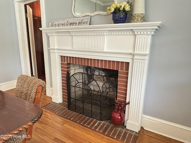 124 W Main St, Woodland, NC 27897 - detailed view of a brick fireplace and wood finished floors