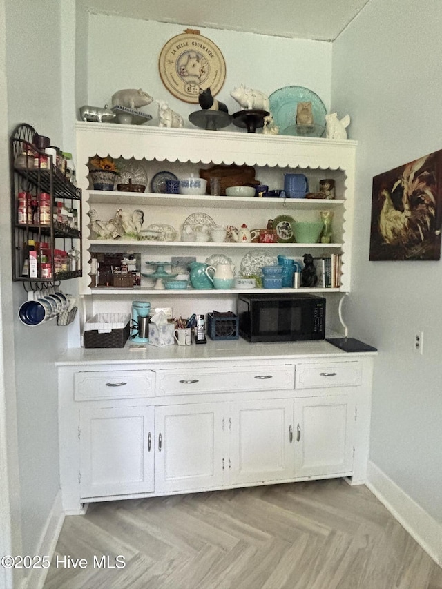 124 W Main St, Woodland, NC 27897 - bar area with black microwave and baseboards