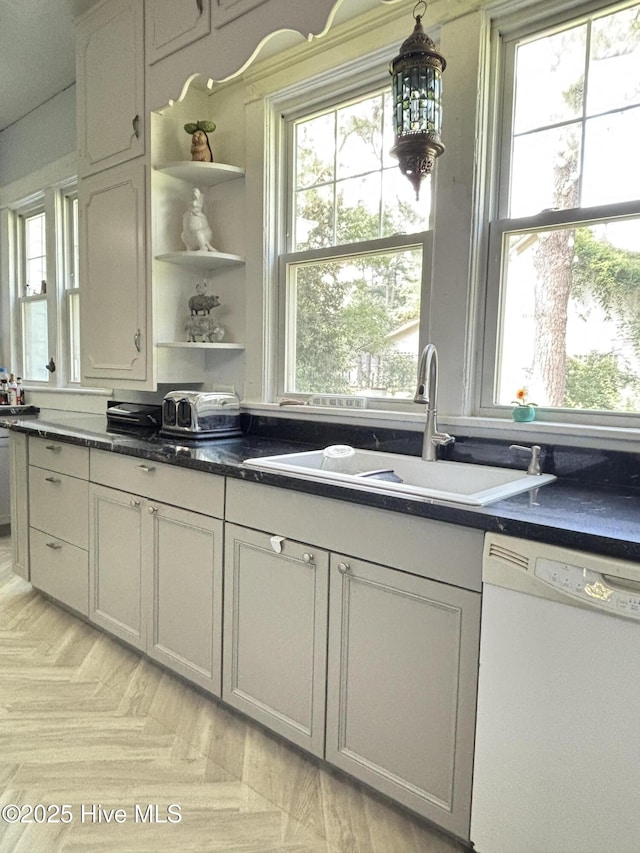124 W Main St, Woodland, NC 27897 - kitchen with white dishwasher, plenty of natural light, and open shelves