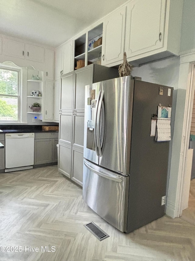 124 W Main St, Woodland, NC 27897 - kitchen with stainless steel refrigerator with ice dispenser, open shelves, dishwasher, and dark countertops
