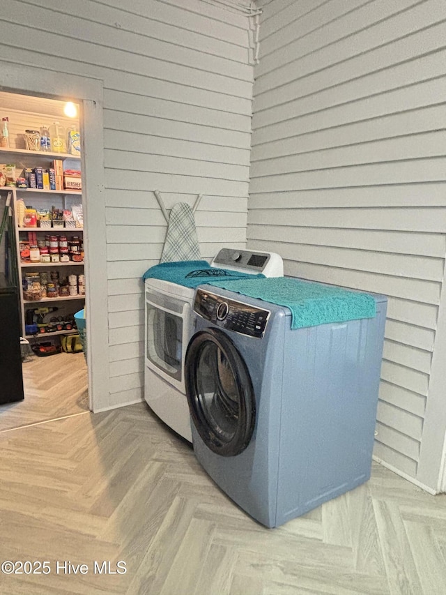 124 W Main St, Woodland, NC 27897 - laundry room featuring washer and clothes dryer and wooden walls