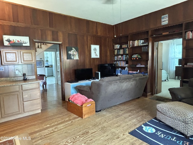 124 W Main St, Woodland, NC 27897 - living area with wooden walls and light wood-style floors