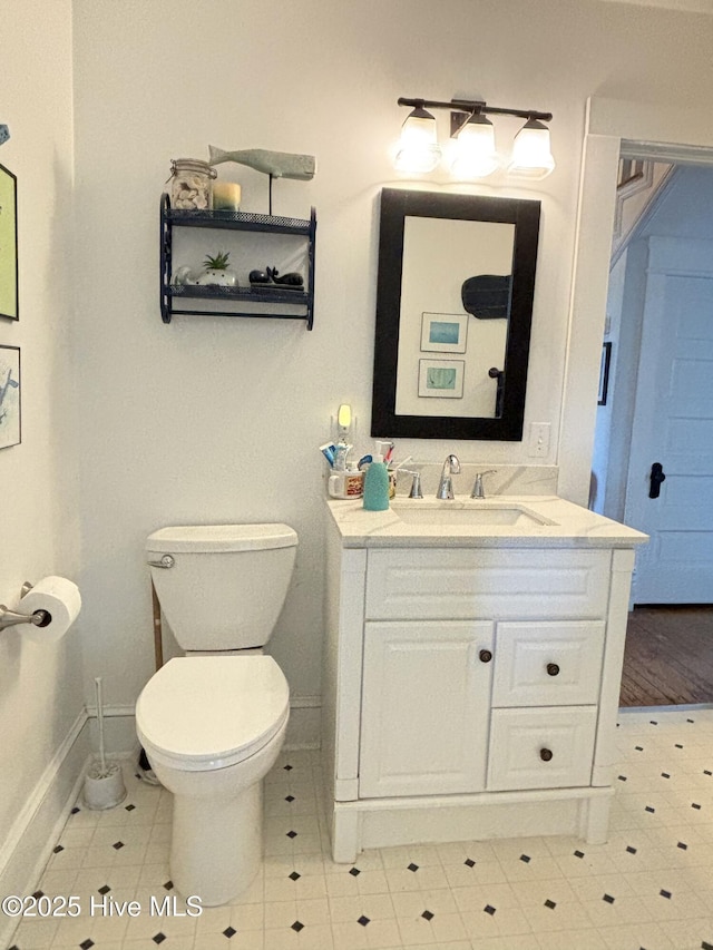 124 W Main St, Woodland, NC 27897 - bathroom featuring vanity and toilet