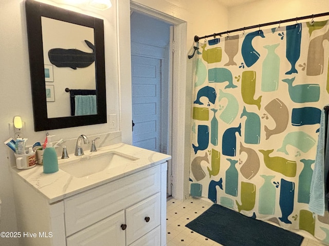 124 W Main St, Woodland, NC 27897 - full bath featuring vanity, curtained shower, and tile patterned floors