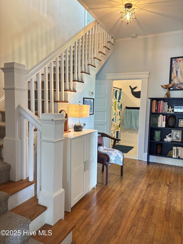 124 W Main St, Woodland, NC 27897 - stairs featuring crown molding and hardwood / wood-style floors