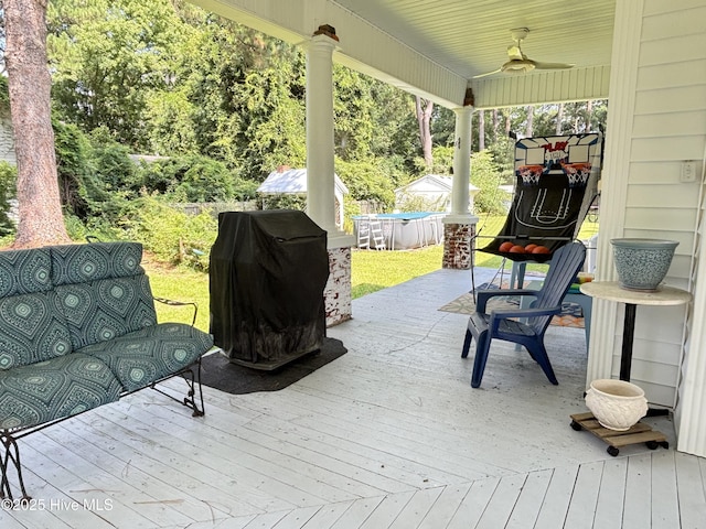 124 W Main St, Woodland, NC 27897 - deck with a ceiling fan and a grill