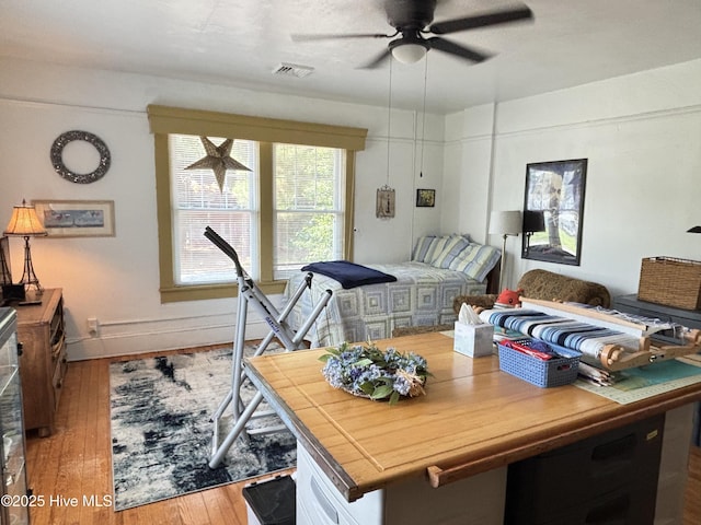 124 W Main St, Woodland, NC 27897 - bedroom with hardwood / wood-style floors and a ceiling fan