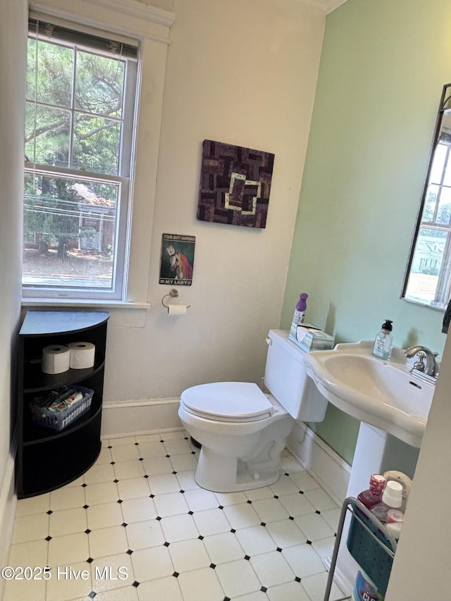 124 W Main St, Woodland, NC 27897 - half bath with toilet and tile patterned floors