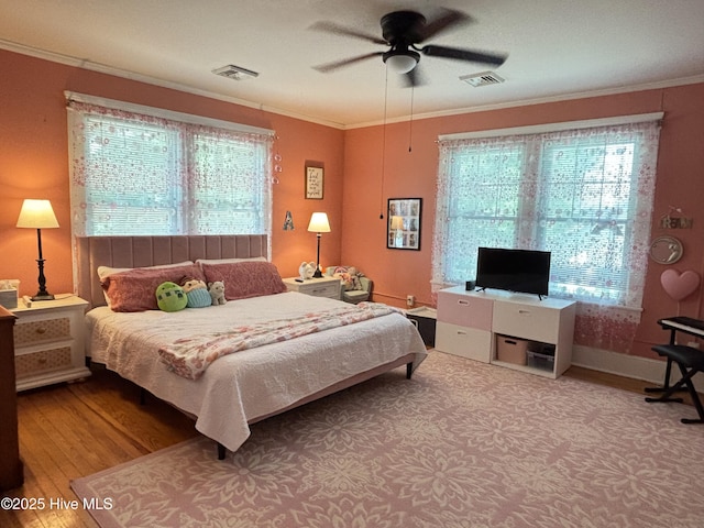 124 W Main St, Woodland, NC 27897 - bedroom with ornamental molding, wood finished floors, and ceiling fan